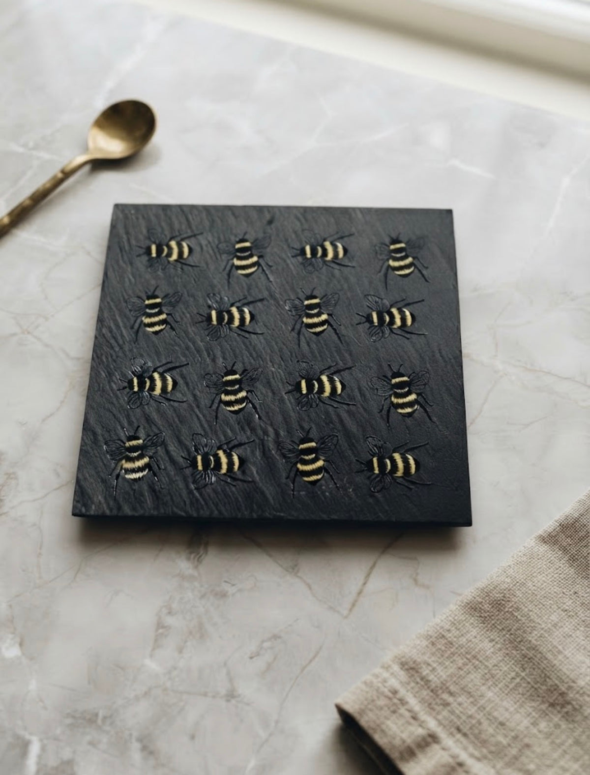 Handcrafted natural slate drink coaster with UV printed bee design