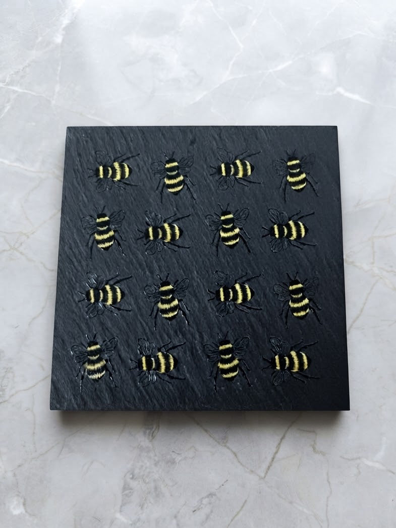 Handcrafted natural slate drink coaster with UV printed bee design